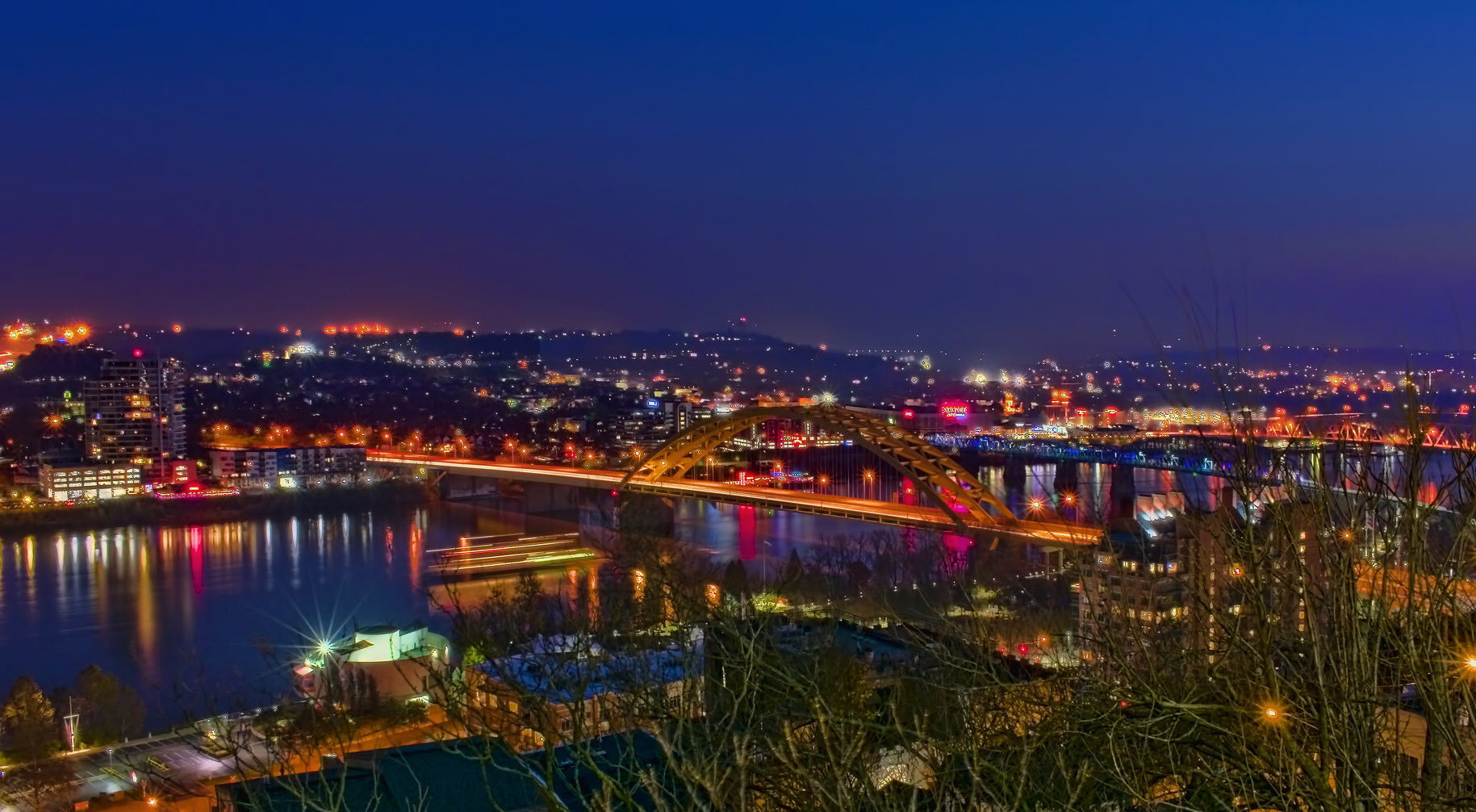 night time view of Northern Kentucky from Cincinnati, showing several cities on Cincinnati's south bank